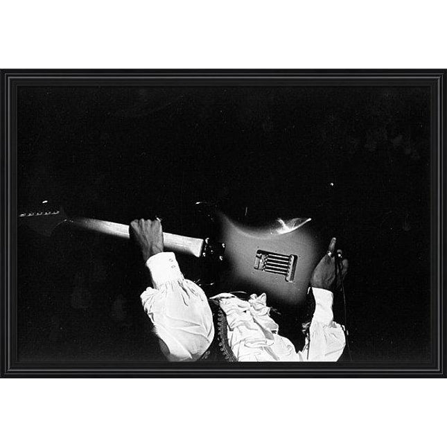 jimi-hendrix-performs-at-monterey-framed-print