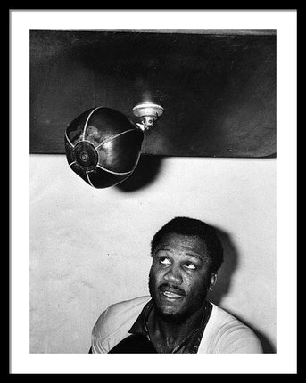 joe-frazier-hits-the-punching-bag-framed-print