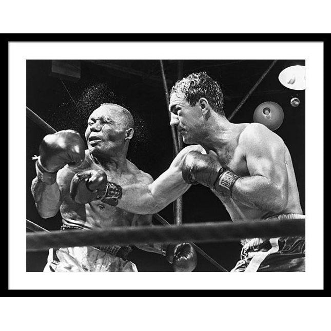 rocky-marciano-landing-a-punch-framed-print
