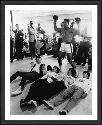 the-beatles-cassius-clay-poses-in-mock-victory
