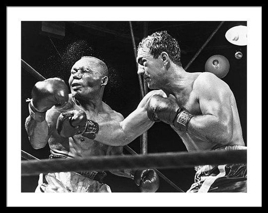 rocky-marciano-landing-a-punch-framed-print