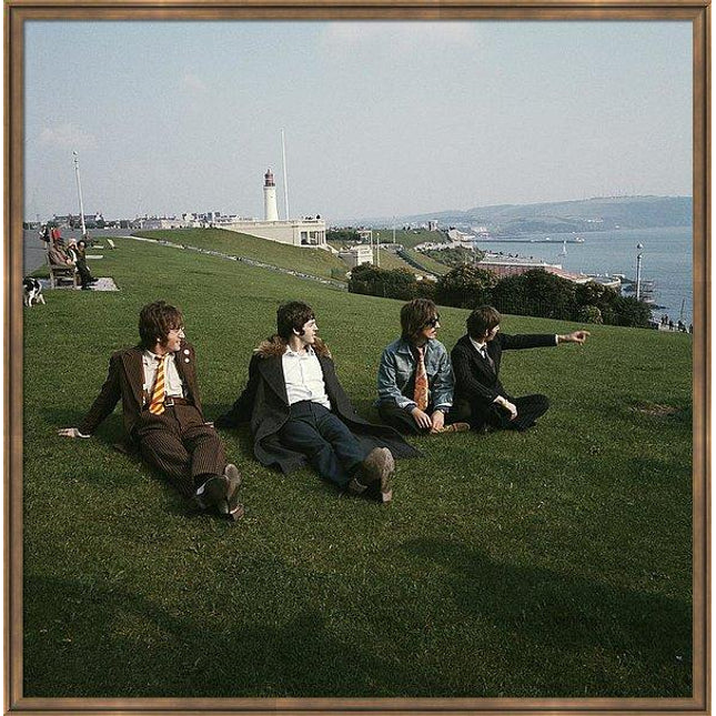 the-beatles-pose-for-a-group-shot-sitting-on-the-grass-at-plymouth-hoe